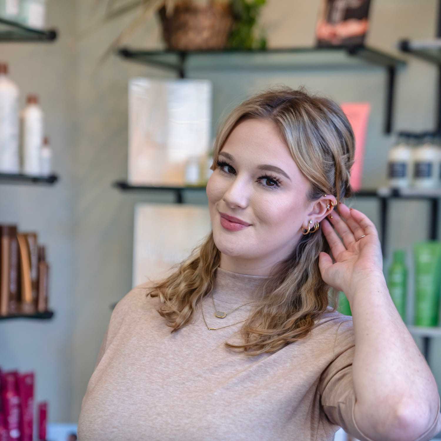 Portrait of Randa, a professional stylist at Salon Sublime, showcasing their expertise and style.