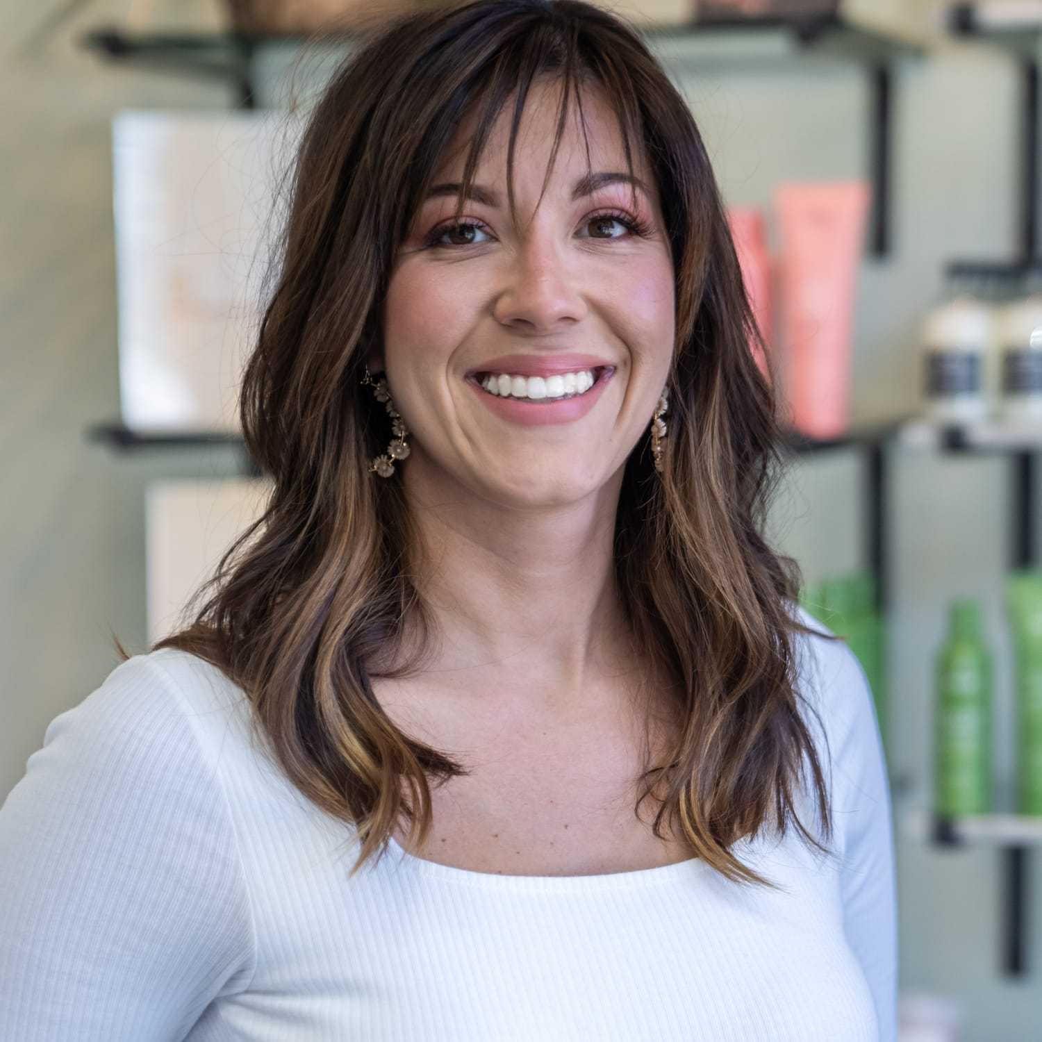 Portrait of Kim, a professional stylist at Salon Sublime, showcasing their expertise and style.