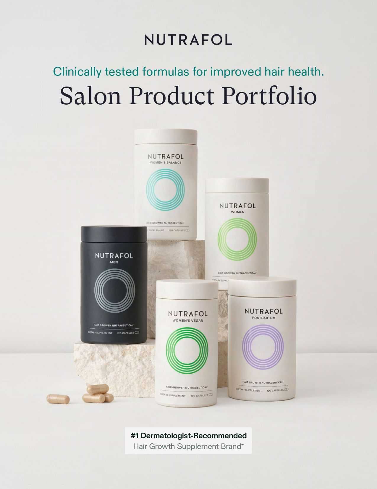 NUTRAFOL hair health salon products displayed on stone blocks with capsules nearby.