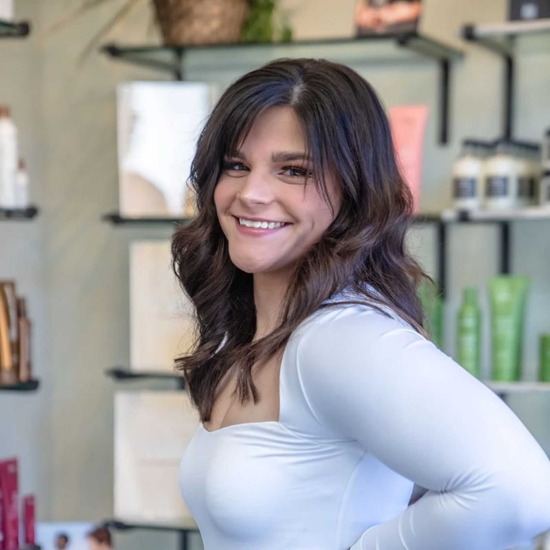 Portrait of Madi, a professional stylist at Salon Sublime, showcasing their expertise and style.