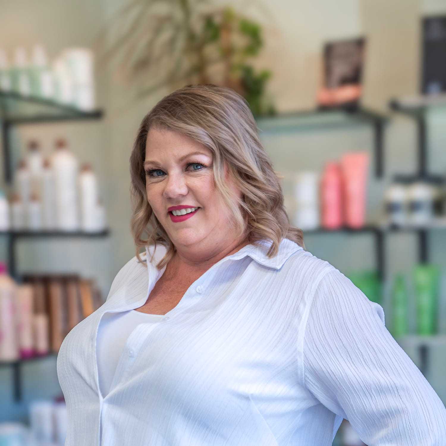 Portrait of Amy, a professional stylist at Salon Sublime, showcasing their expertise and style.