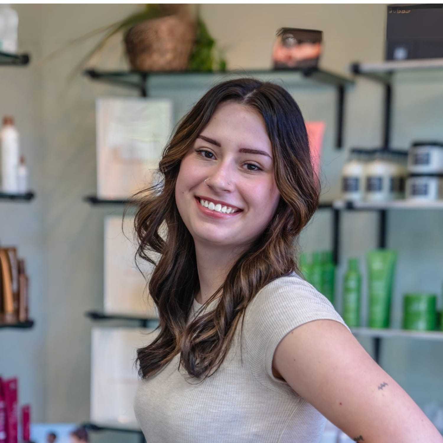 Portrait of Olivia, a professional stylist at Salon Sublime, showcasing their expertise and style.